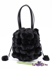 shoulder bag with pom poms