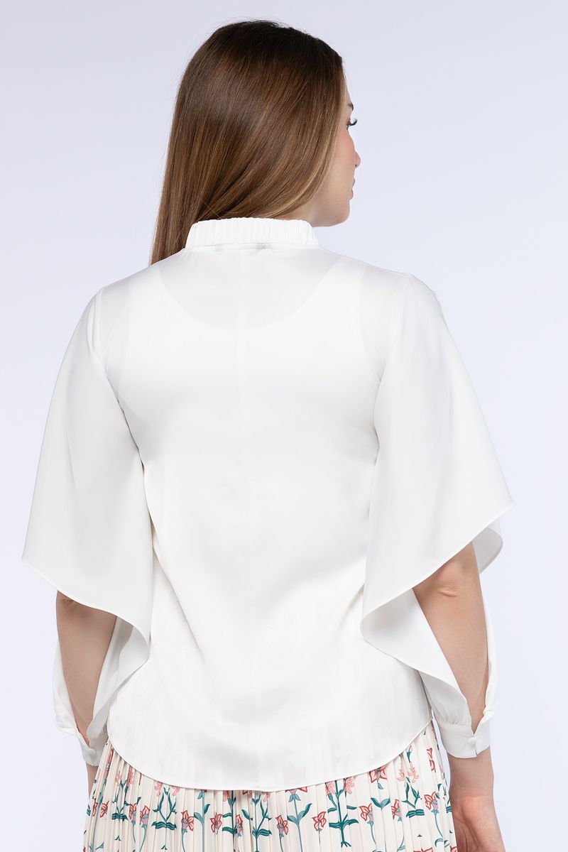 women top with open cut sleeves