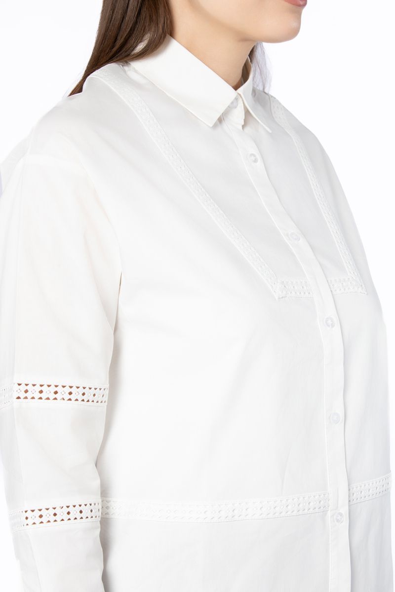 قميص نسائي بتطريز وفتحات مخرمة