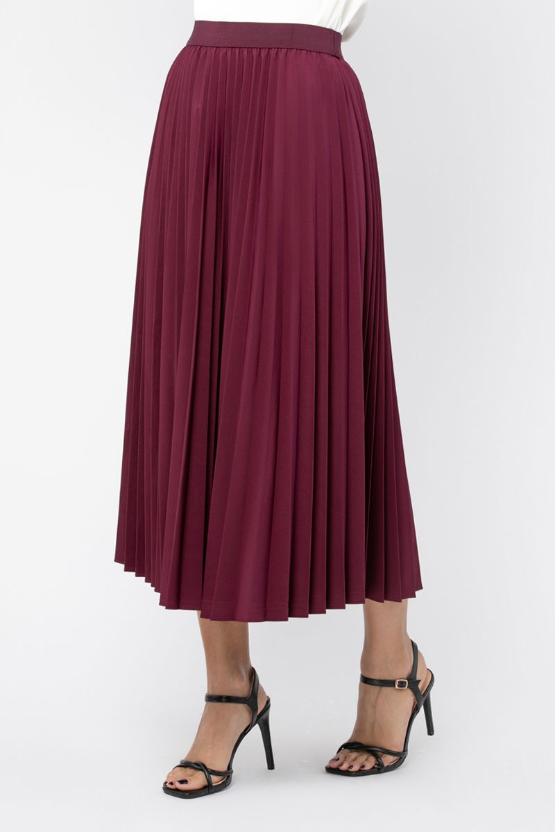 تنورة نسائية بلون موحد ونمط كسرات