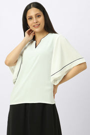 بلوزة نسائية بأكمام عريضة واسعة