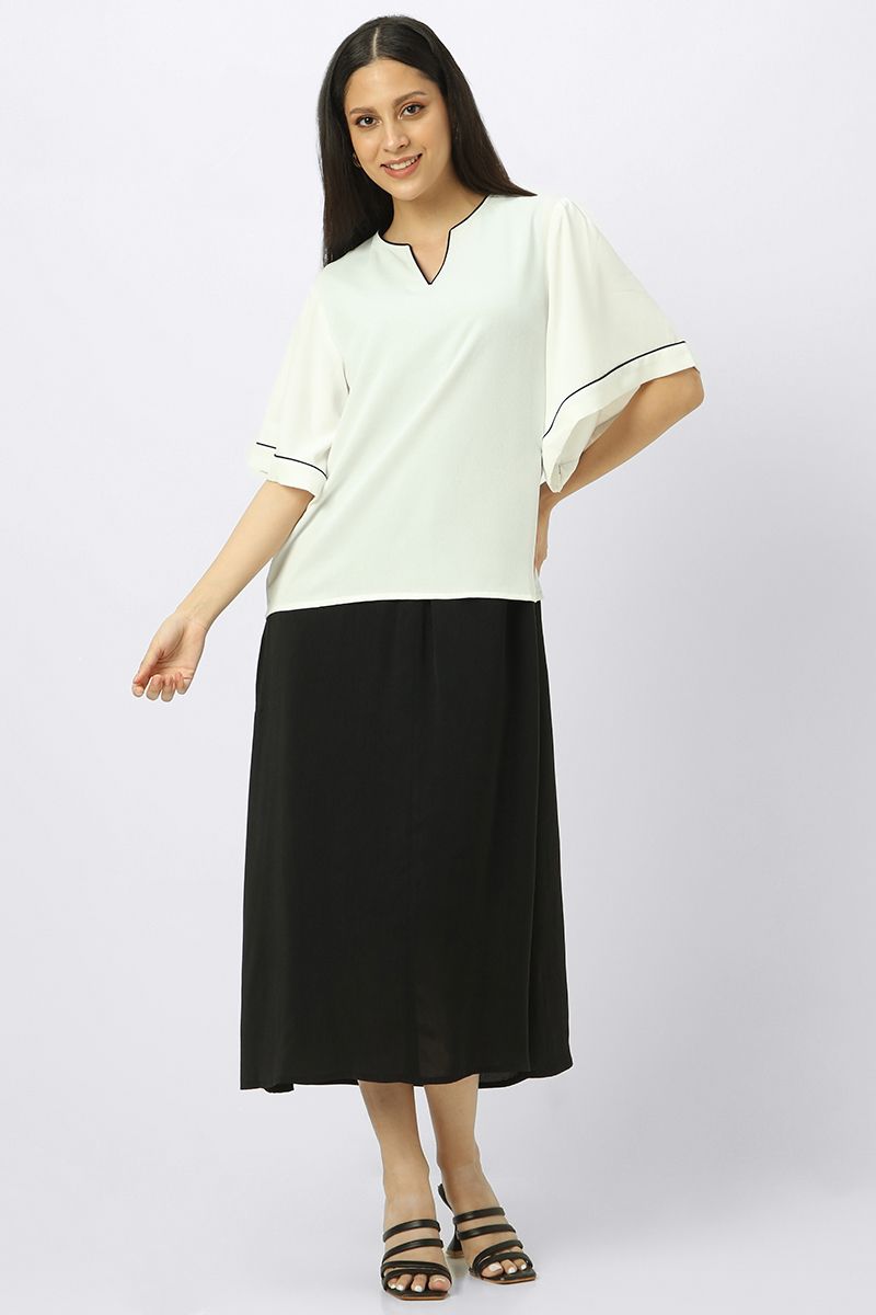 بلوزة نسائية بأكمام عريضة واسعة