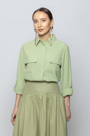 قميص نسائي بأكمام طويلة ولون سادة