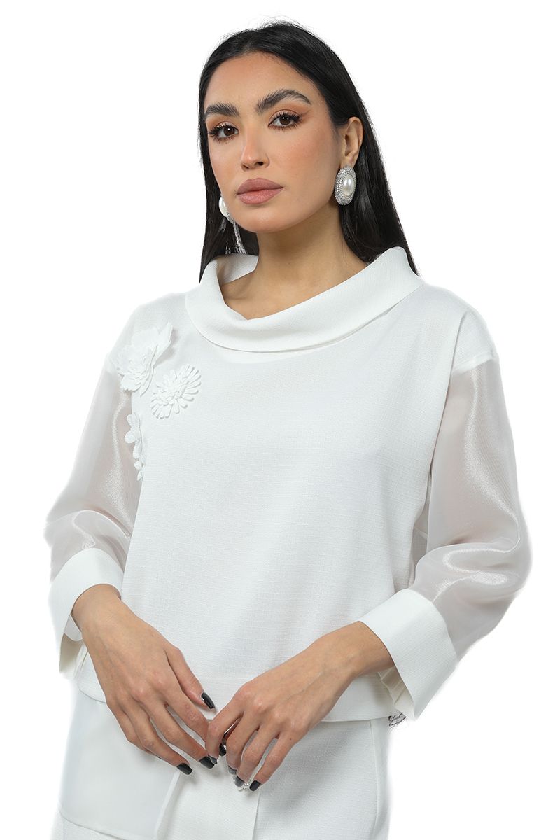 women top with floral ornaments