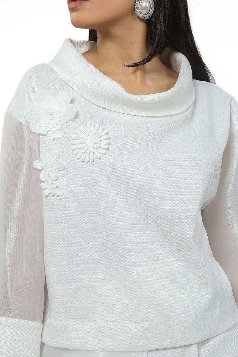 women top with floral ornaments