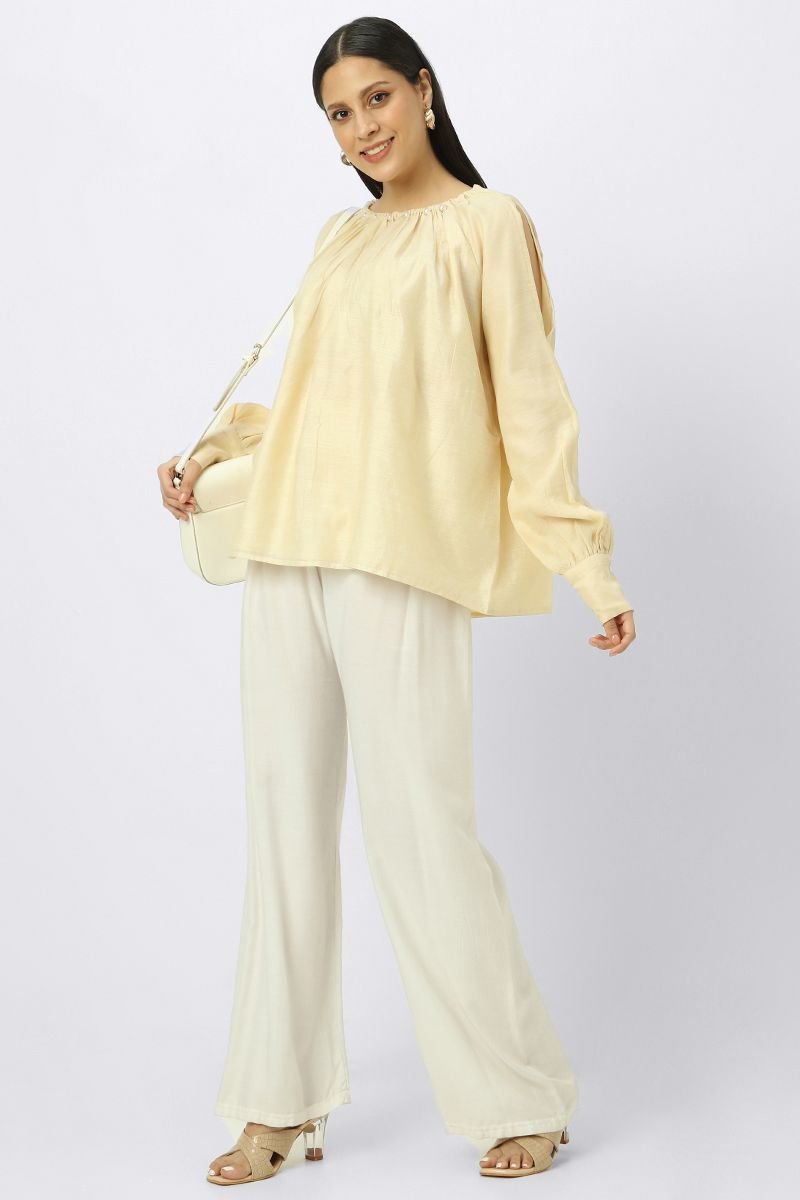 women top with slashed sleeves and back strap