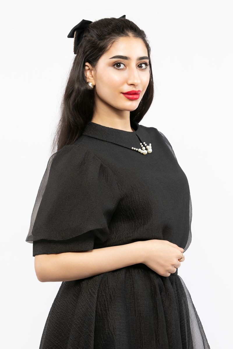 women top with puffed organza sleeves