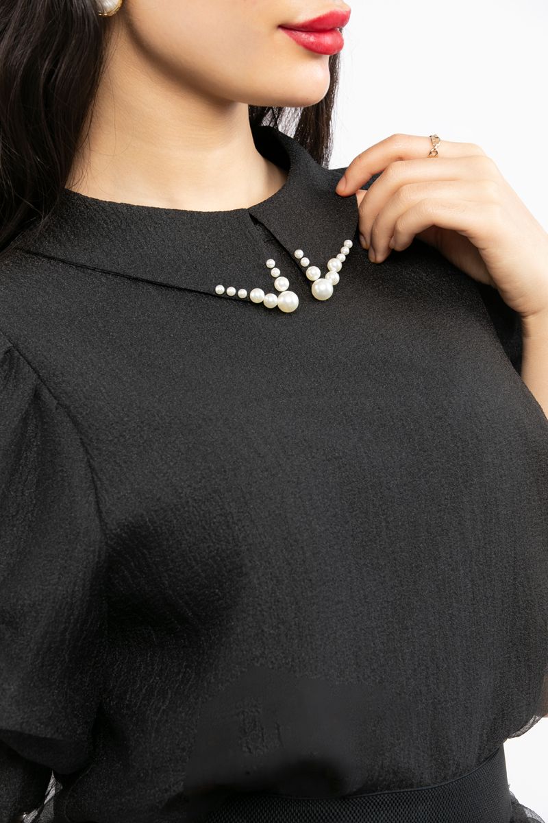 women top with puffed organza sleeves