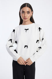 knit blouse with bow embellishments