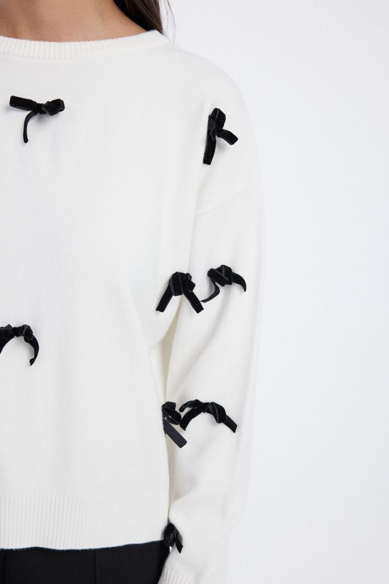 knit blouse with bow embellishments