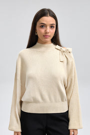 توب تريكو بكتف مكشوف وفيونكة